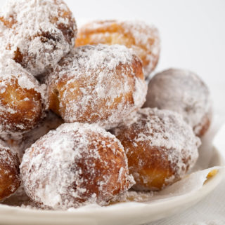 brioche donut holes with powdered sugar close up